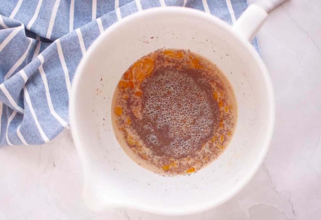 Custard base in a white mixing bowl.
