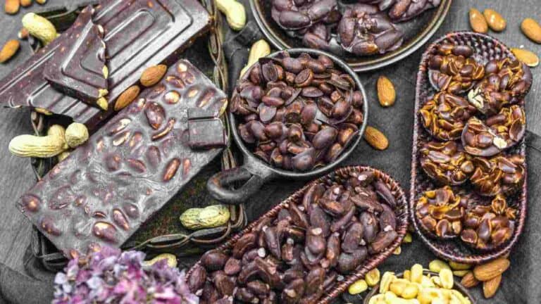 A variety of chocolate bars with nuts.