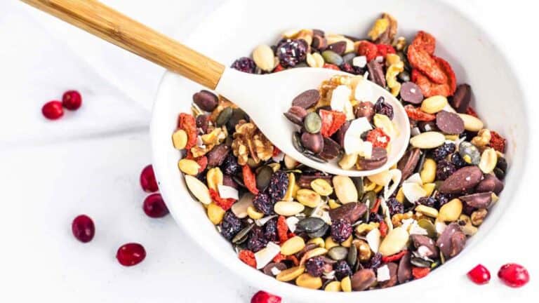 A bowl containing trail mix.