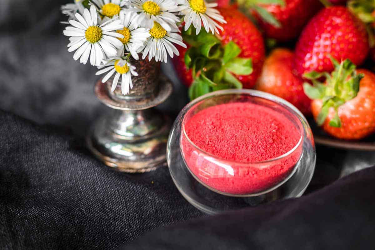 A small glass bowl of powdered strawberries.