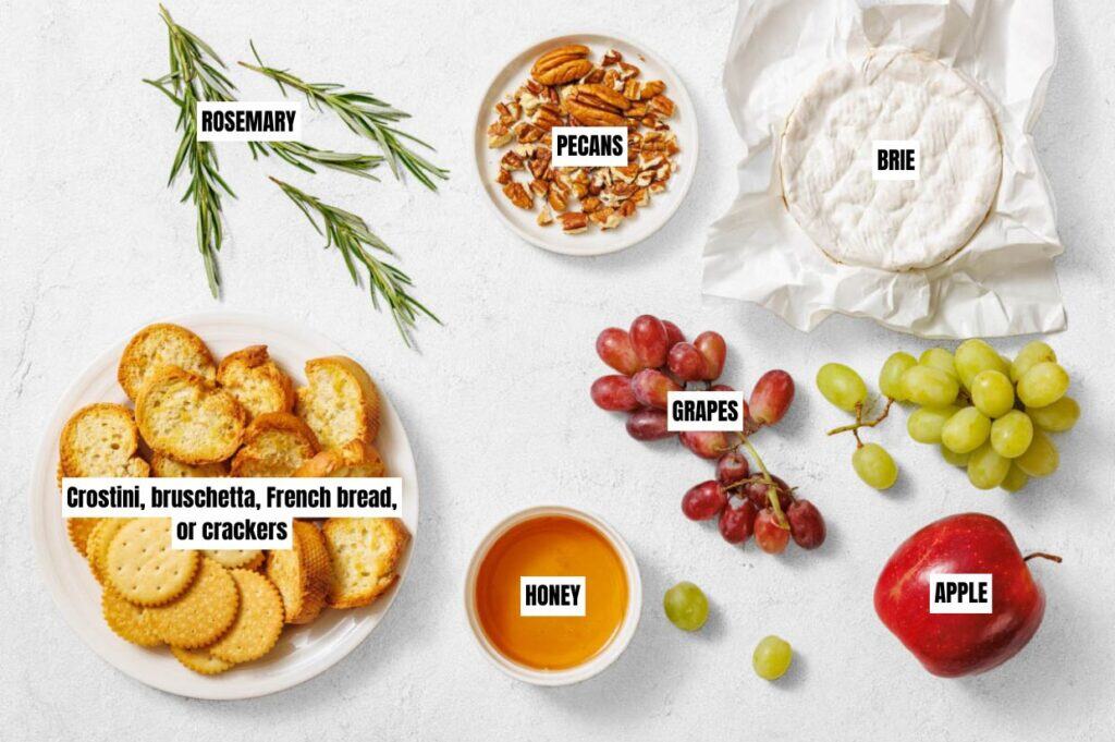 An assortment of cheeses, fresh fruits, nuts, and crackers displayed on a rustic cheese board.