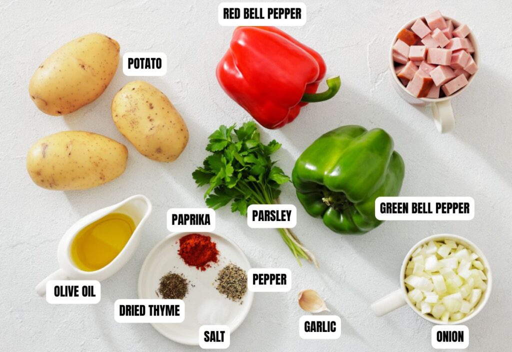 Ingredients for a recipe, including potatoes, red and green bell peppers, diced ham, olive oil, parsley, onion, garlic, paprika, dried thyme, salt, and pepper.