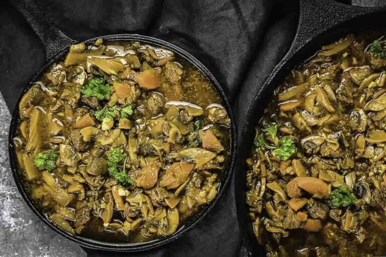 Beef stew topped with fresh parsley.