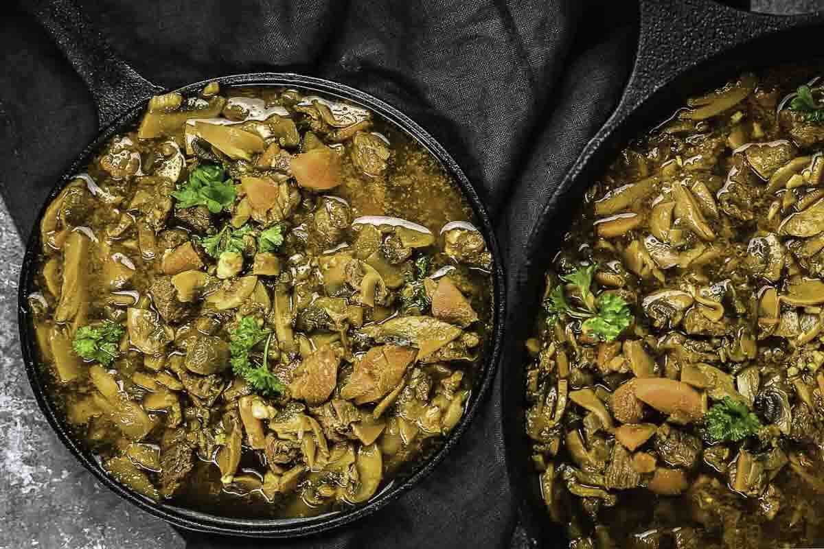Beef stew topped with fresh parsley.