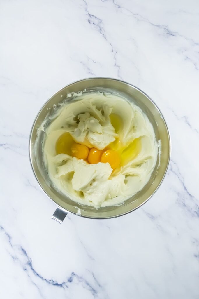 Cream cheese base, eggs in mixing bowl for Southern Supper Club recipes.