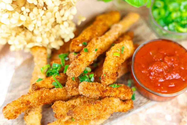 Crispy chicken fries made in an air fryer, served with dipping sauce.