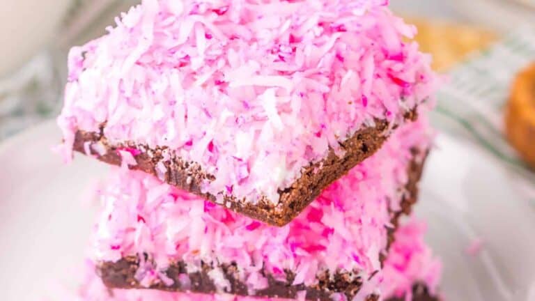 Pink coconut topping on chocolate brownies.