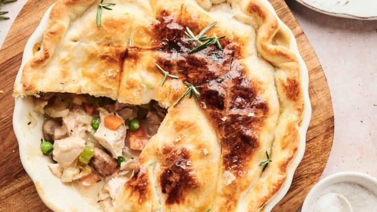 Golden brown turkey pot pie with a flaky crust, filled with savory chicken and vegetables.