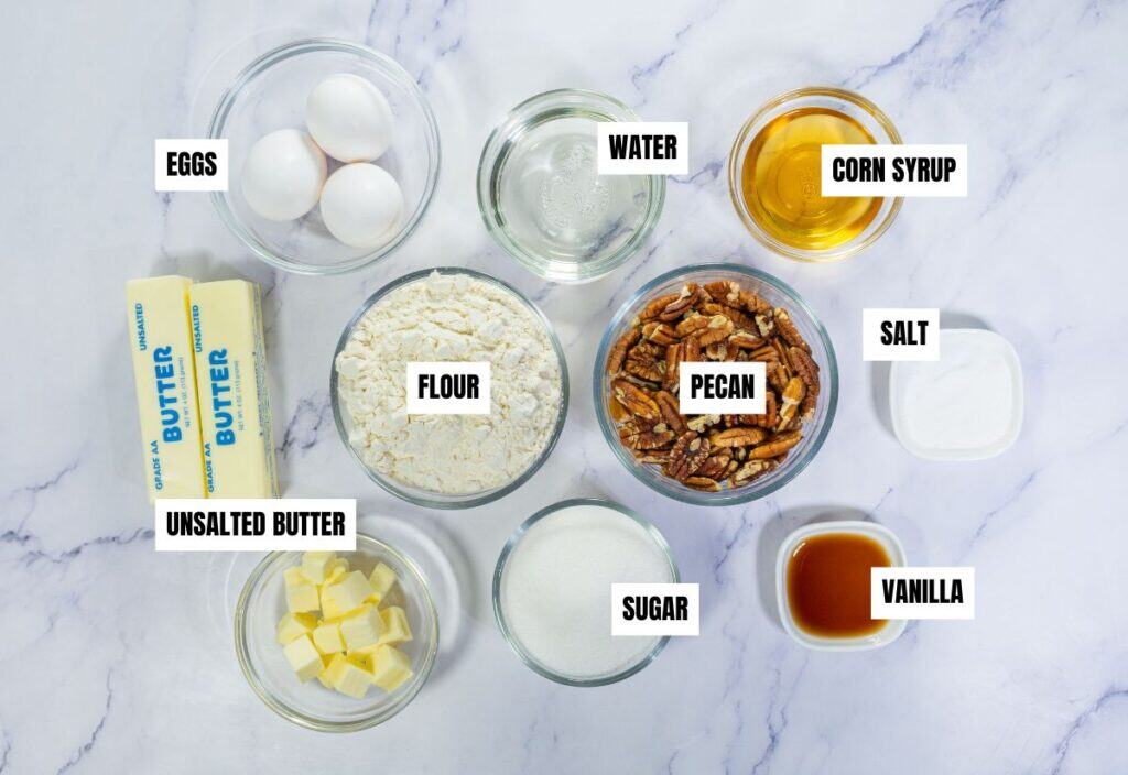 A collection of ingredients for Bourbon Pecan Pie, including eggs, butter, flour, pecans, sugar, and more, arranged in bowls.