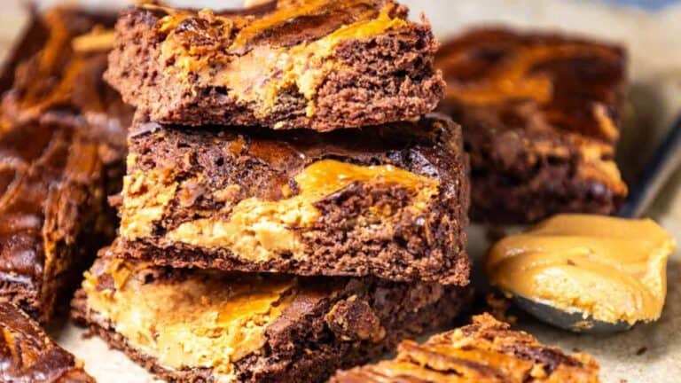 Rich chocolate brownies with a peanut butter swirl, sliced to show the smooth, peanut butter-filled interior.