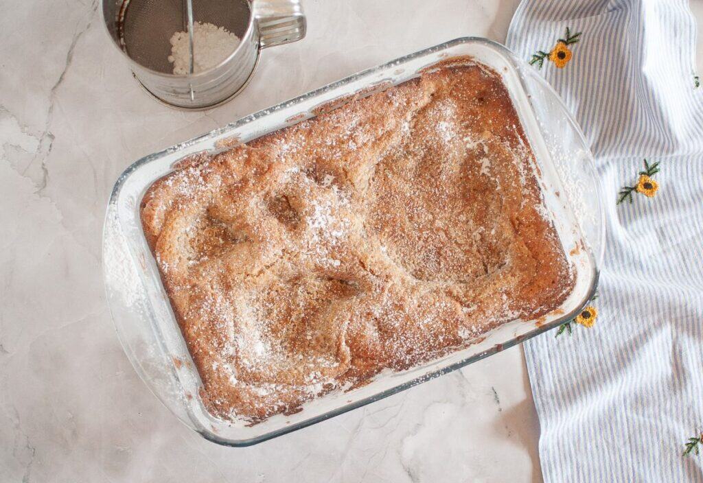 The finished gooey butter cake baked to a golden brown, ready for serving.