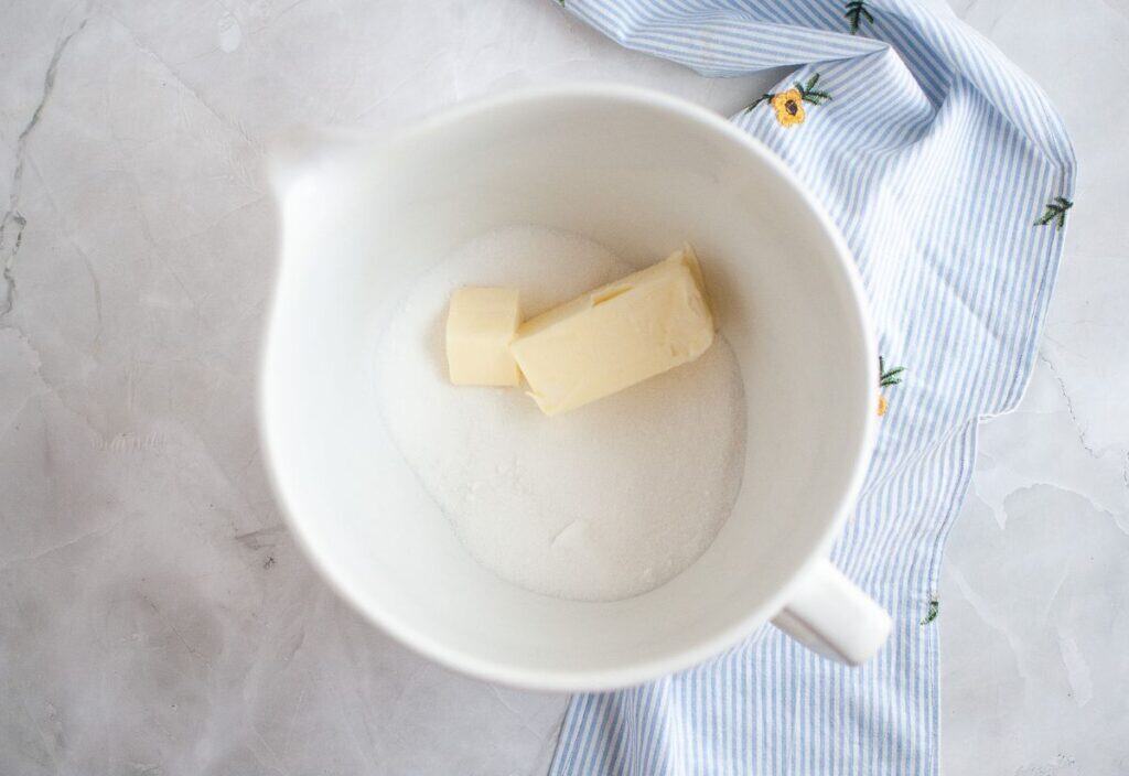 The mixture of butter, sugar, and egg for the topping in the stand mixer.