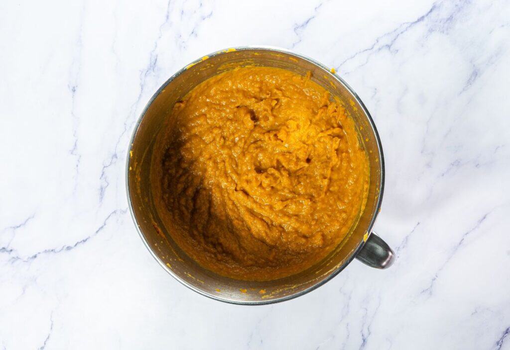 Sweet potato casserole mixture fully blended until smooth in a mixing bowl.
