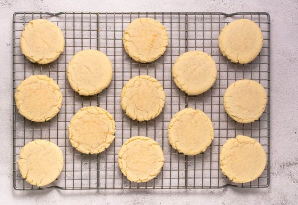 Cooling freshly baked cookies on a wire rack.