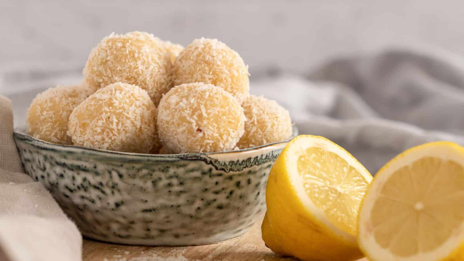 A bowl of Lemon Cheesecake Bliss Balls.